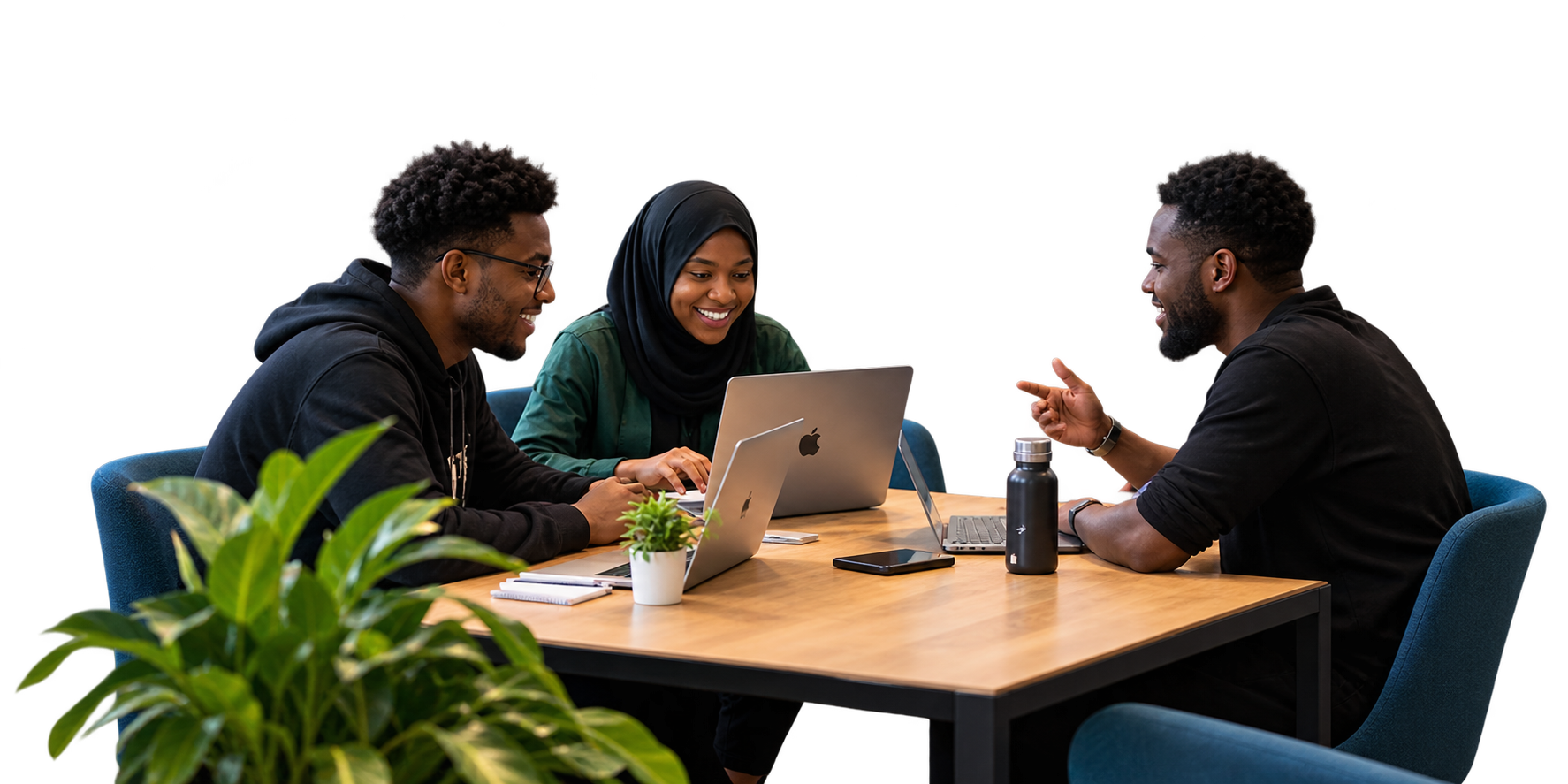 Three colleagues working together on laptops around a table at The Cime Hub